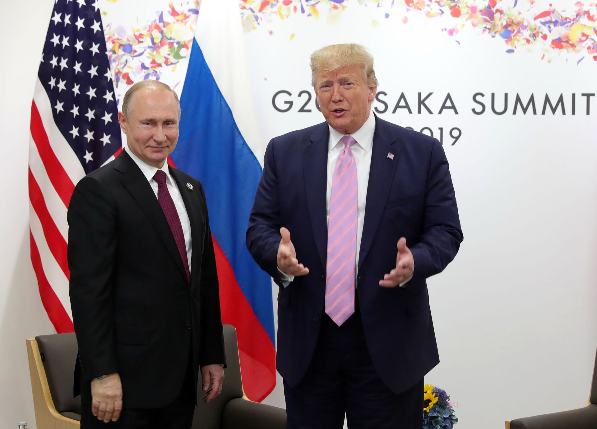 U.S. President Donald Trump, right, and Russian President Vladimir Putin pose for a photo during a bilateral meeting on the sidelines of the G-20 summit in Osaka, Japan, Friday, June 28, 2019. - Sputnik International, 1920, 10.11.2021