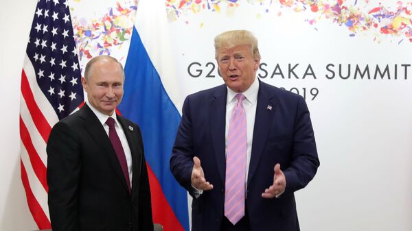 U.S. President Donald Trump, right, and Russian President Vladimir Putin pose for a photo during a bilateral meeting on the sidelines of the G-20 summit in Osaka, Japan, Friday, June 28, 2019. - Sputnik International
