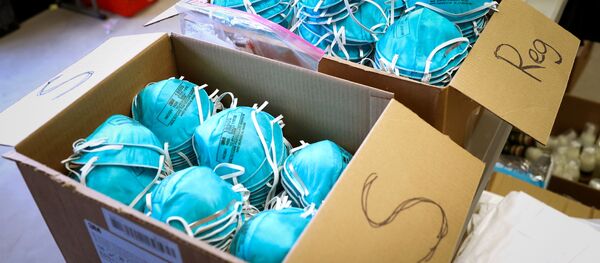 Boxes of N95 protective masks for use by medical field personnel are seen at a New York State emergency operations incident command center during the coronavirus outbreak in New Rochelle, New York, U.S., March 17, 2020.  - Sputnik International