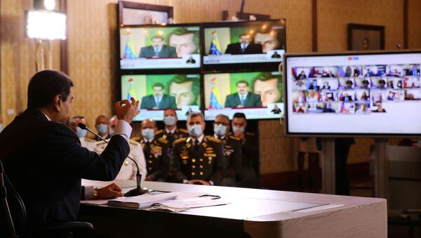 Screens are seen as Venezuela's President Nicolas Maduro holds a virtual news conference in Caracas, Venezuela May 6, 2020.  - Sputnik International