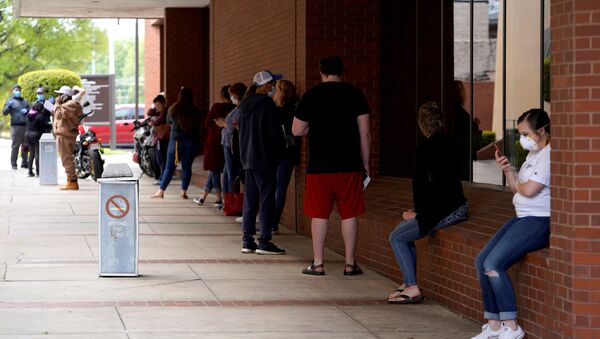 People who lost their jobs wait in line to file for unemployment following an outbreak of the coronavirus disease (COVID-19), at an Arkansas Workforce Center in Fort Smith, Arkansas, U.S. April 6, 2020 - Sputnik International