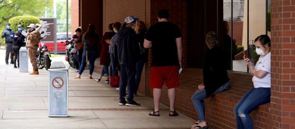 People who lost their jobs wait in line to file for unemployment following an outbreak of the coronavirus disease (COVID-19), at an Arkansas Workforce Center in Fort Smith, Arkansas, U.S. April 6, 2020 People who lost their jobs wait in line to file for unemployment following an outbreak of the coronavirus disease (COVID-19), at an Arkansas Workforce Center in Fort Smith, Arkansas, U.S. April 6, 2020 - Sputnik International