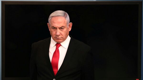 Israeli Prime Minister Benjamin Netanyahu arrives for a speech at his Jerusalem office, regarding the new measures that will be taken to fight the coronavirus, March 14, 2020 - Sputnik International