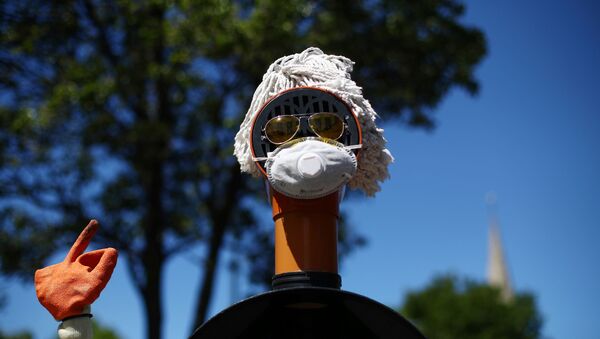 A sculpture surrounding a bollard consisting of plumbing materials, sunglasses and a protective face mask is seen in Lewisham following the outbreaK of coronavirus disease (COVID-19), London, Britain, May 5, 2020 - Sputnik International