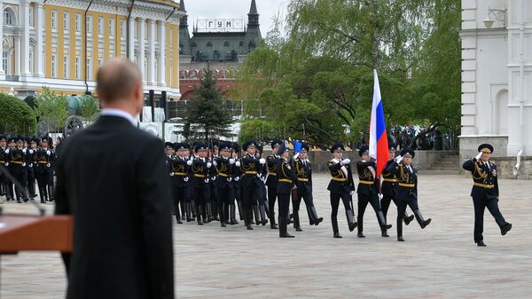 Russian President Vladimir Putin attends a parade of the Kremlin Regiment - also known as the Presidential Regiment - as part of the Victory Day events commemorating its 75th anniversary - Sputnik International