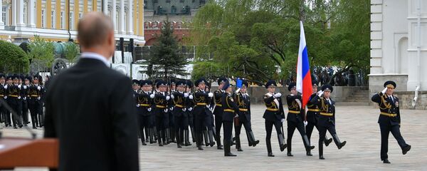 Russian President Vladimir Putin attends a parade of the Kremlin Regiment - also known as the Presidential Regiment - as part of the Victory Day events commemorating its 75th anniversary - Sputnik International