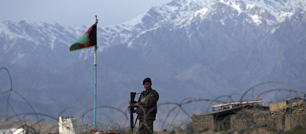 An Afghan National Army soldier stands guard at a checkpoint near the Bagram base north of Kabul, Afghanistan, Wednesday, April 8, 2020. An Afghan official said Wednesday that the country has released 100 Taliban prisoners from Bagram, claiming they are part of 5,000 detainees who are to be freed under a deal between insurgents and U.S. But the Taliban says they have yet to verify those released were on the list they had handed over to Washington during negotiations. An Afghan National Army soldier stands guard at a checkpoint near the Bagram base north of Kabul, Afghanistan, Wednesday, April 8, 2020. An Afghan official said Wednesday that the country has released 100 Taliban prisoners from Bagram, claiming they are part of 5,000 detainees who are to be freed under a deal between insurgents and U.S. But the Taliban says they have yet to verify those released were on the list they had handed over to Washington during negotiations. - Sputnik International