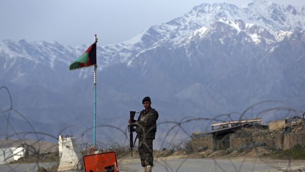 An Afghan National Army soldier stands guard at a checkpoint near the Bagram base north of Kabul, Afghanistan, Wednesday, April 8, 2020. An Afghan official said Wednesday that the country has released 100 Taliban prisoners from Bagram, claiming they are part of 5,000 detainees who are to be freed under a deal between insurgents and U.S. But the Taliban says they have yet to verify those released were on the list they had handed over to Washington during negotiations. - Sputnik International