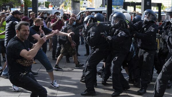 Police officers use pepper spray at a demonstration on Alexanderplatz, in Berlin - Sputnik International