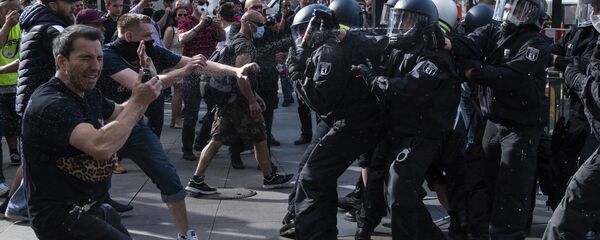 Police officers use pepper spray at a demonstration on Alexanderplatz, in Berlin - Sputnik International