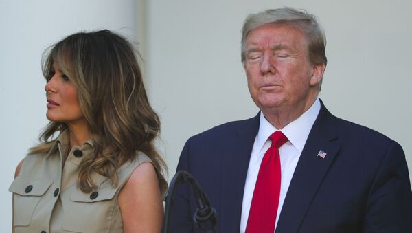 First lady Melania Trump stands with U.S. President Donald Trump as he closes his eyes during the White House National Day of Prayer Service in the Rose Garden at the White House in Washington, U.S., May 7, 2020. - Sputnik International