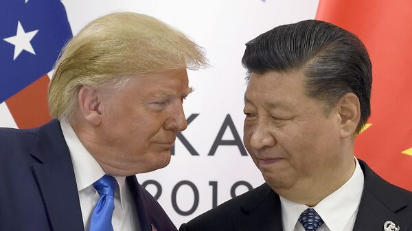 In this June 29, 2019, file photo, President Donald Trump, left, meets with Chinese President Xi Jinping during a meeting on the sidelines of the G-20 summit in Osaka, Japan. - Sputnik International
