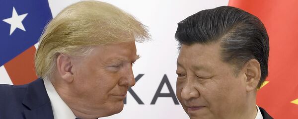 In this June 29, 2019, file photo, President Donald Trump, left, meets with Chinese President Xi Jinping during a meeting on the sidelines of the G-20 summit in Osaka, Japan. - Sputnik International