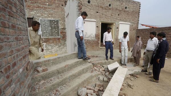 Pakistani Christians visit the site of a vandalized church in a village near Lahore, Pakistan, Monday, May 11, 2020 - Sputnik International