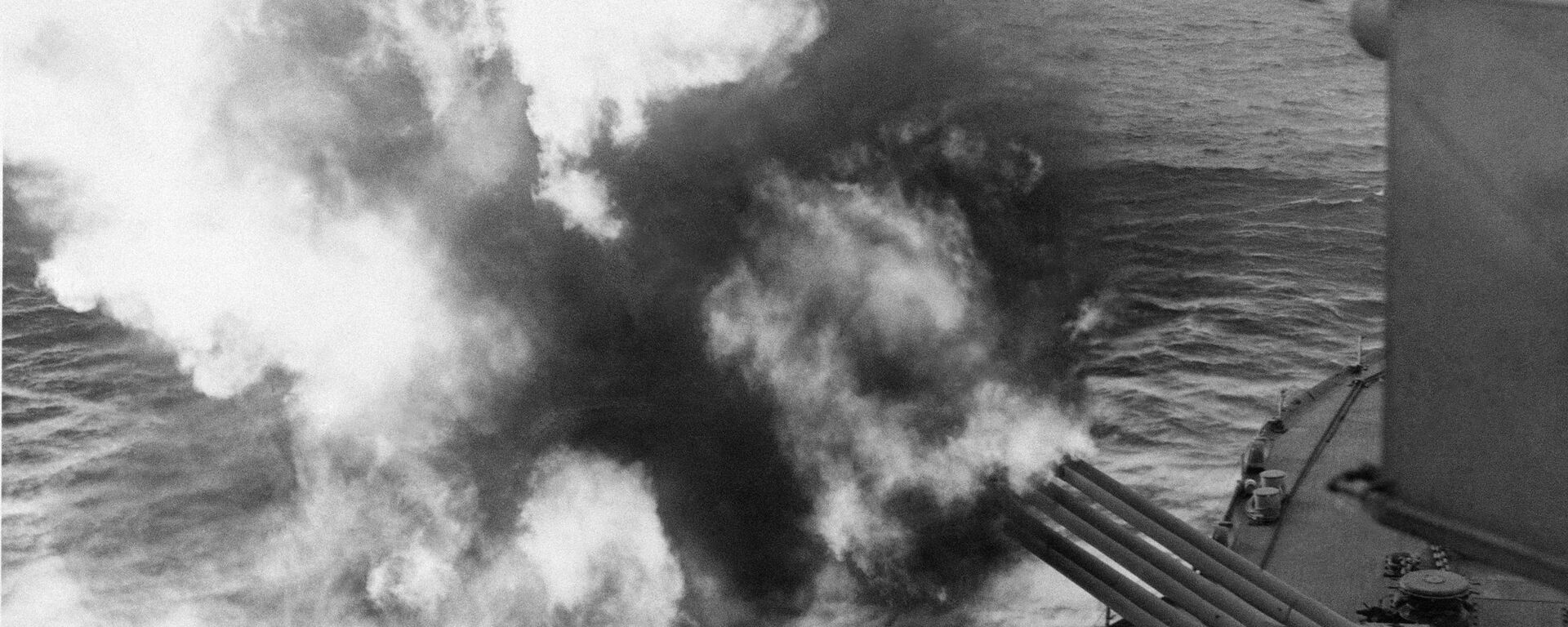 Mushrooms of smoke and flame billow out from the giant USS Nevada as the battleship provides artillery support for Allied ground forces in France by hammering enemy installations from her vantage point in the English Channel, June 6, 1944. - Sputnik International, 1920, 12.05.2020