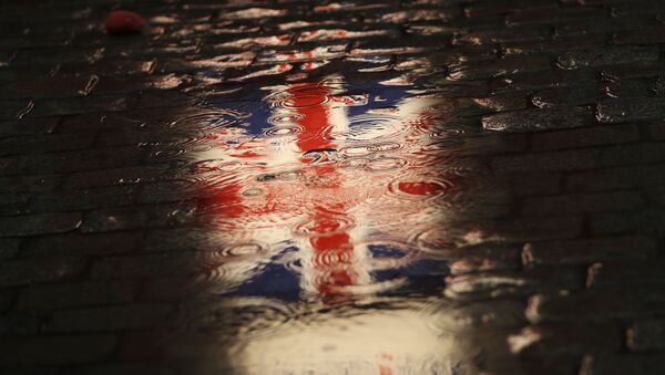 The Union flag is reflected in a puddle during an event called Brussels calling to celebrate the friendship between Belgium and Britain at the Grand Place in Brussels, Thursday, Jan. 30, 2020 - Sputnik International