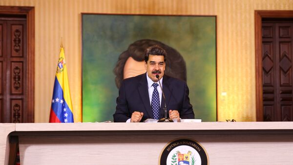 Handout picture released by the Venezuelan Presidency showing Venezuelan President Nicolas Maduro speaking during a video conference meeting with international media correspondents, at Miraflores Presidential Palace in Caracas, on May 6, 2020. - Sputnik International