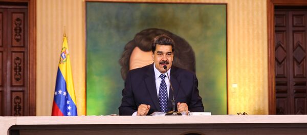 Handout picture released by the Venezuelan Presidency showing Venezuelan President Nicolas Maduro speaking during a video conference meeting with international media correspondents, at Miraflores Presidential Palace in Caracas, on May 6, 2020. - Sputnik International