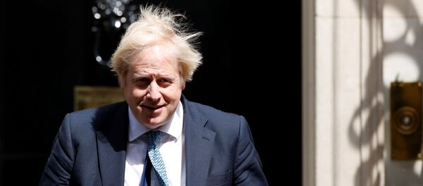 Britain's Prime Minister Boris Johnson is seen at 10 Downing Street, following the outbreak of the coronavirus disease (COVID-19), London, Britain, May 13, 2020 Britain's Prime Minister Boris Johnson is seen at 10 Downing Street, following the outbreak of the coronavirus disease (COVID-19), London, Britain, May 13, 2020 - Sputnik International