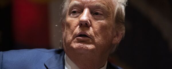 President Donald Trump listens during a meeting with North Dakota Gov. Doug Burgum and Colorado Gov. Jared Polis on the coronavirus response, in the Cabinet Room of the White House, Wednesday, May 13, 2020, in Washington. President Donald Trump listens during a meeting with North Dakota Gov. Doug Burgum and Colorado Gov. Jared Polis on the coronavirus response, in the Cabinet Room of the White House, Wednesday, May 13, 2020, in Washington. - Sputnik International