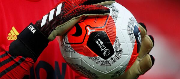 ILE PHOTO: Soccer Football - Premier League - Manchester United v Watford - Old Trafford, Manchester, Britain - February 23, 2020  General view of a match ball held by Manchester United's David de Gea during the warm up before the match - Sputnik International