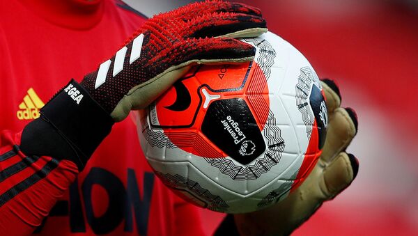 ILE PHOTO: Soccer Football - Premier League - Manchester United v Watford - Old Trafford, Manchester, Britain - February 23, 2020  General view of a match ball held by Manchester United's David de Gea during the warm up before the match - Sputnik International