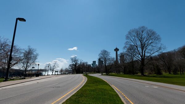  A empty road in the town of Niagara Falls is seen during the coronavirus pandemic on April 27 2020 in Niagara Falls, Canada - Sputnik International