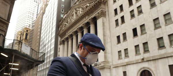 A man wears a protective mask as he walks past the New York Stock Exchange on the corner of Wall and Broad streets during the coronavirus outbreak in New York City, New York, U.S., March 13, 2020 - Sputnik International