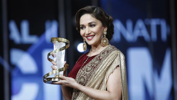 Indian actress Madhuri Dixit holds her award for her contribution to acting, during the 15th Marrakech International Film Festival in Marrakech, Morocco, Saturday, Dec. 5, 2015 - Sputnik International
