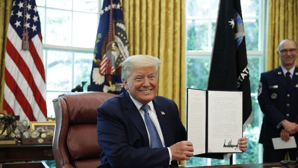 President Donald Trump smiles after signing an Armed Forces Day Proclamation in the Oval Office of the White House, Friday, May 15, 2020, in Washington. - Sputnik International