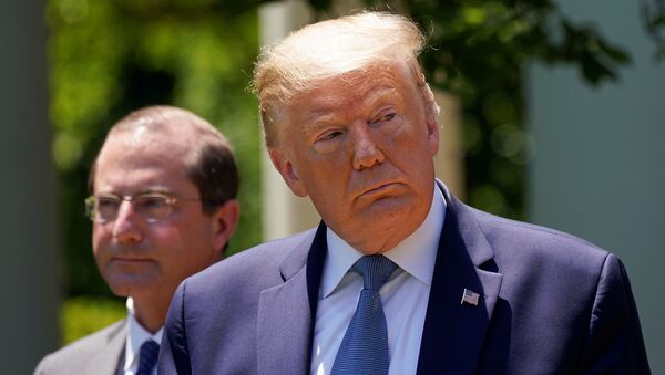 U.S. President Donald Trump speaks about administration efforts to develop a vaccine as Health and Human Services Secretary (HHS) Alex Azar listens during a coronavirus disease (COVID-19) pandemic response event in the Rose Garden at the White House in Washington, U.S., May 15, 2020 - Sputnik International