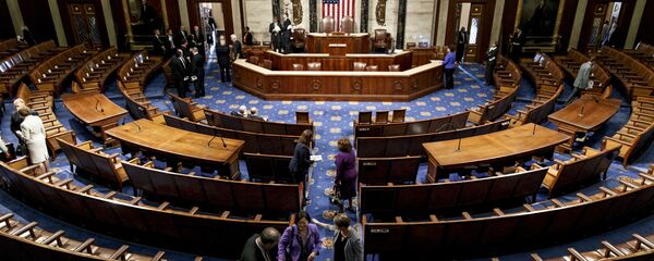 The chamber of the House of Representatives empties following a joint meeting of Congress, at the Capitol in Washington, Thursday, Sept. 18, 2014, with visiting Ukranian President Petro Poroshenko. The House and Senate are wrapping up business and heading to their home states for the weeks leading up to the midterm elections The chamber of the House of Representatives empties following a joint meeting of Congress, at the Capitol in Washington, Thursday, Sept. 18, 2014, with visiting Ukranian President Petro Poroshenko. The House and Senate are wrapping up business and heading to their home states for the weeks leading up to the midterm elections - Sputnik International