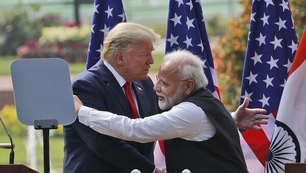 U.S. President Donald Trump and Indian Prime Minister Narendra Modi embrace after giving a joint statement in New Delhi, India, Tuesday, Feb. 25, 2020. - Sputnik International