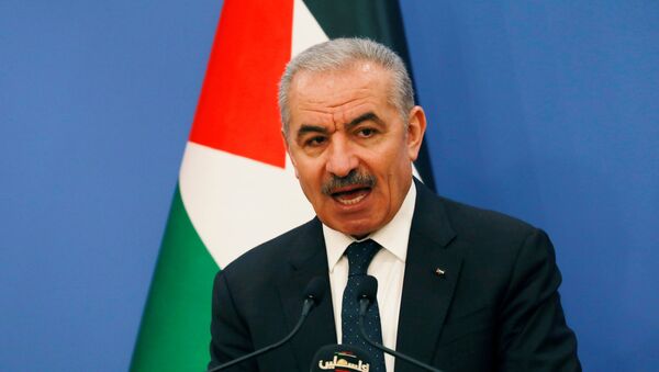 Palestinian Prime Minister Mohammad Shtayyeh speaks before the start of the weekly cabinet meeting in Ramallah in the Israeli-occupied West Bank May 11, 2020. - Sputnik International