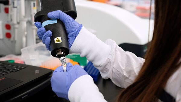 A scientist at RNA medicines company Arcturus Therapeutics research a vaccine for the novel coronavirus (COVID-19) at a laboratory in San Diego, California, U.S., March 17, 2020 - Sputnik International