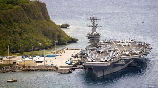 The aircraft carrier USS Theodore Roosevelt (CVN 71) is moored pier side at Naval Base Guam May 15, 2020. Theodore Roosevelt's COVID-negative crew returned from quarantine beginning on April 29 and is making preparations to return to sea to continue their scheduled deployment to the Indo-Pacific. - Sputnik International