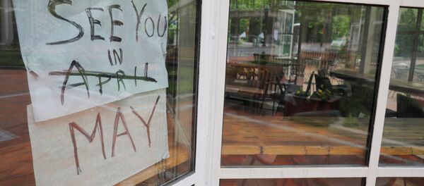 The sign on Sip Cafe reads See you in May, with April crossed out, amid the coronavirus disease (COVID-19) outbreak in Boston, Massachusetts, U.S., May 18, 2020. The sign on Sip Cafe reads See you in May, with April crossed out, amid the coronavirus disease (COVID-19) outbreak in Boston, Massachusetts, U.S., May 18, 2020. - Sputnik International