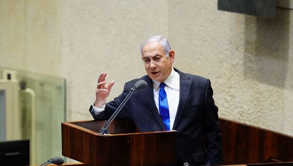 Israeli Prime Minister Benjamin Netanyahu speaks during a swearing in ceremony of his new unity government with election rival Benny Gantz, at the Knesset, Israel's parliament, in Jerusalem May 17, 2020 - Sputnik International