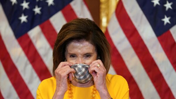 Speaker of the House Nancy Pelosi puts on her face mask to protect from the coronavirus disease (COVID-19) after taking part in a ceremonial swearing-in for Rep. Mike Garcia (R-CA) in Washington, U.S., May 19, 2020 - Sputnik International
