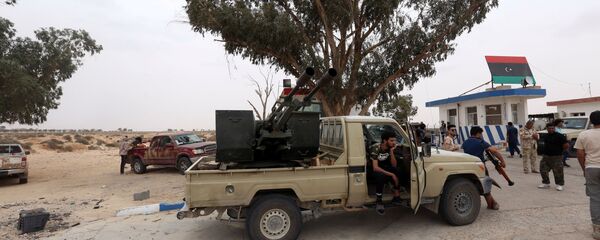 Fighters loyal to Libya's internationally recognised government are seen after taking control of Watiya airbase, southwest of Tripoli, Libya, 18 May 2020. Fighters loyal to Libya's internationally recognised government are seen after taking control of Watiya airbase, southwest of Tripoli, Libya, 18 May 2020. - Sputnik International