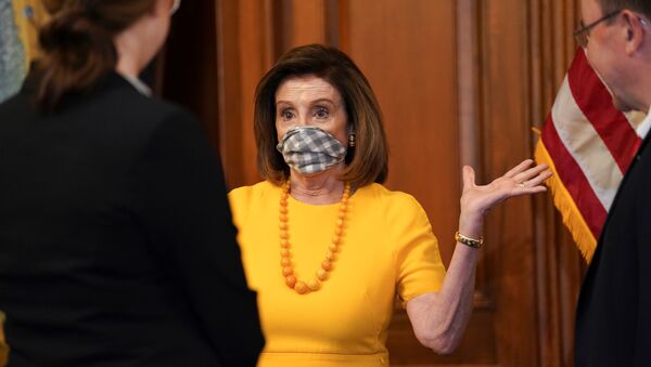 Speaker of the House Nancy Pelosi wears a face mask to protect from the coronavirus disease (COVID-19) during a ceremonial swearing-in for Rep. Tom Tiffany (R-WI) in Washington, U.S., May 19, 2020 - Sputnik International