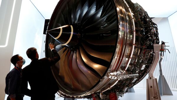 A man looks at Rolls Royce's Trent Engine displayed at the Singapore Airshow in Singapore February 11, 2020 - Sputnik International