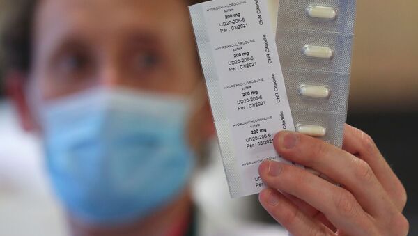A pharmacy worker shows pills of hydroxychloroquine used to treat the coronavirus disease (COVID-19) at the CHR Centre Hospitalier Regional de la Citadelle Hospital in Liege, Belgium, April 22, 2020 - Sputnik International