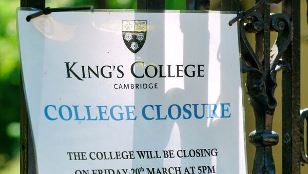 A sign at Kings College Cambridge, announcing its March closure, is displayed on the university's gates amid the novel coronavirus outbreak, in Cambridge, Britain May 20, 2020 - Sputnik International