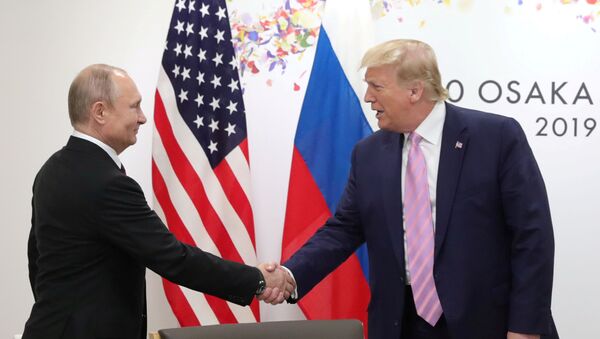 Russia's President Vladimir Putin shakes hands with U.S. President Donald Trump during a meeting on the sidelines of the G20 summit in Osaka, Japan June 28, 2019. - Sputnik International