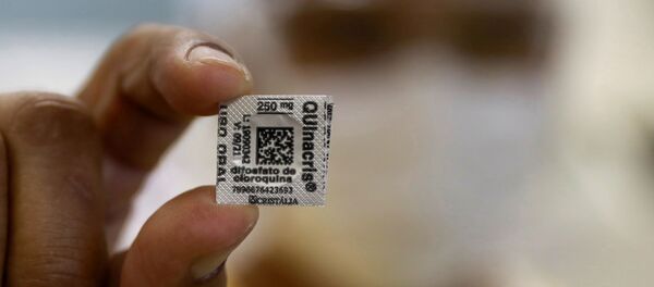 A nurse shows a Hydroxychloroquine pill, amid the coronavirus disease (COVID-19) outbreak, at Nossa Senhora da Conceicao hospital in Porto Alegre, Brazil, April 23, 2020 - Sputnik International