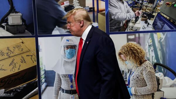 U.S. President Donald Trump walks past a display of photographs while touring the Ford Rawsonville Components Plant, which is making ventilators and medical supplies, during the coronavirus disease (COVID-19) pandemic in Ypsilanti, Michigan, U.S., May 21, 2020. - Sputnik International