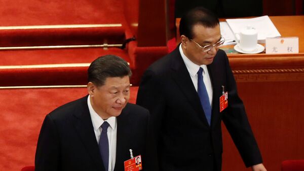 Chinese President Xi Jinping and Premier Li Keqiang arrive at the opening session of the National People's Congress (NPC) at the Great Hall of the People in Beijing, China May 22, 2020 - Sputnik International