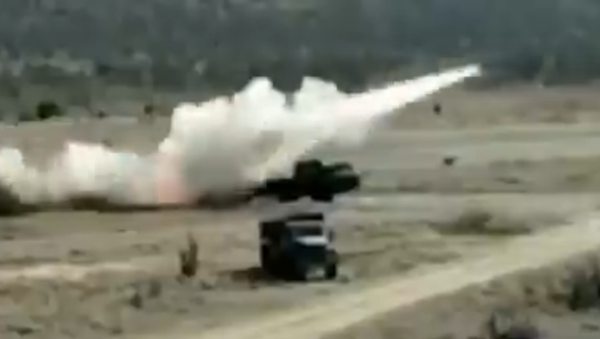 A Venezuelan BM-30 Smerch fires a rocket during drills on Isla La Orchila - Sputnik International