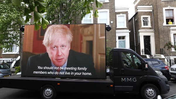A Led by donkeys truck displaying a video of Britain's Prime Minister Boris Johnson, drives by Dominic Cummings' house in London, following the outbreak of the coronavirus disease (COVID-19), London, Britain, May 24, 2020. - Sputnik International